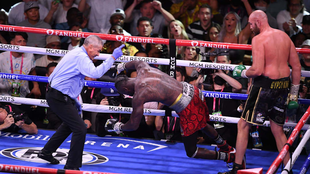 Deontay Wilder falls to the mat after getting knocked out by Tyson Fury. Deontay Wilder falls to the mat after getting knocked out by Tyson Fury.